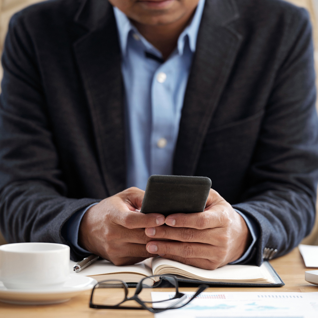Businessman checking phone